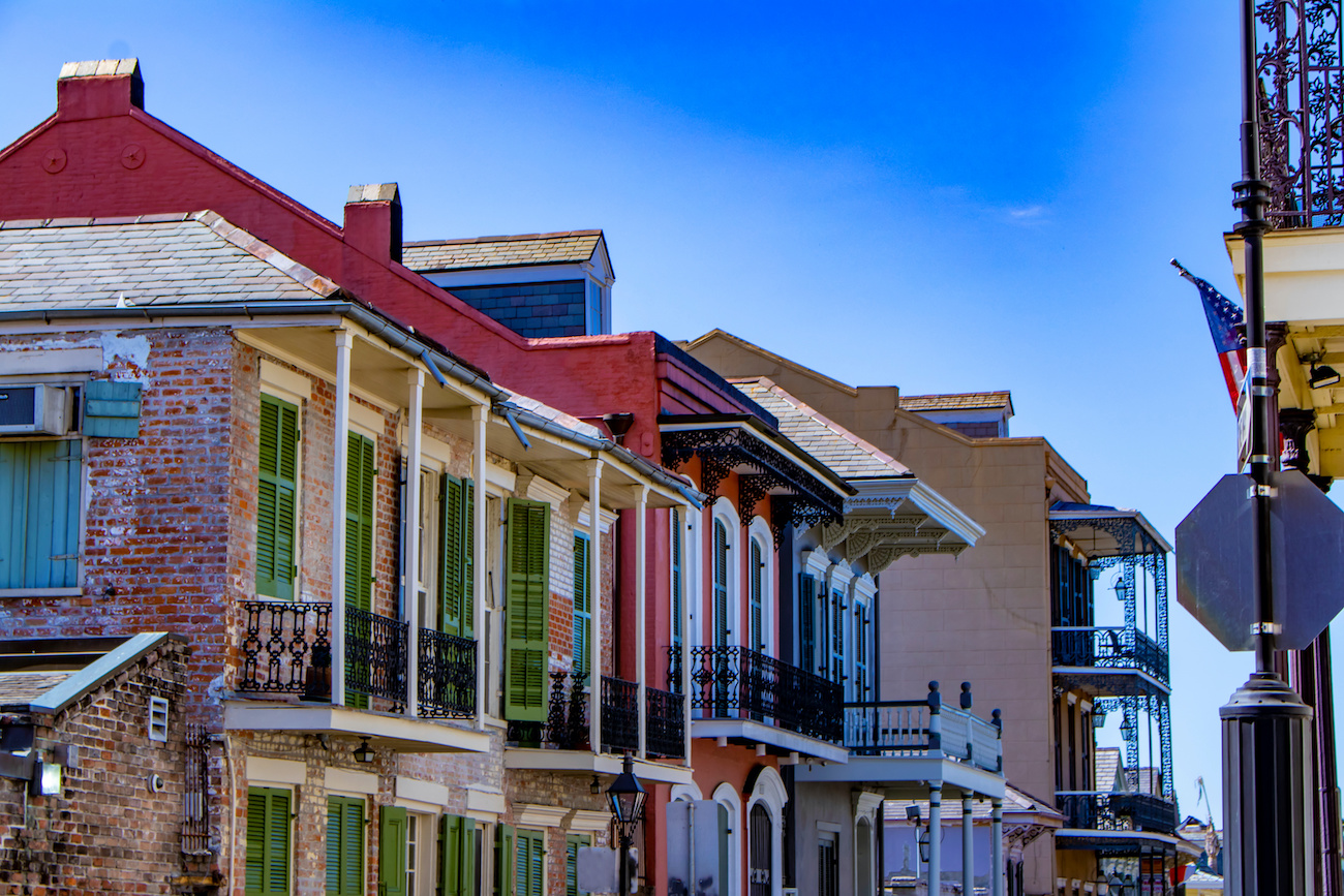 Beautiful Colored Brick and Stucco Homes Line One of the Many Streets in the French Quarter of New Orleans, Louisiana, USA